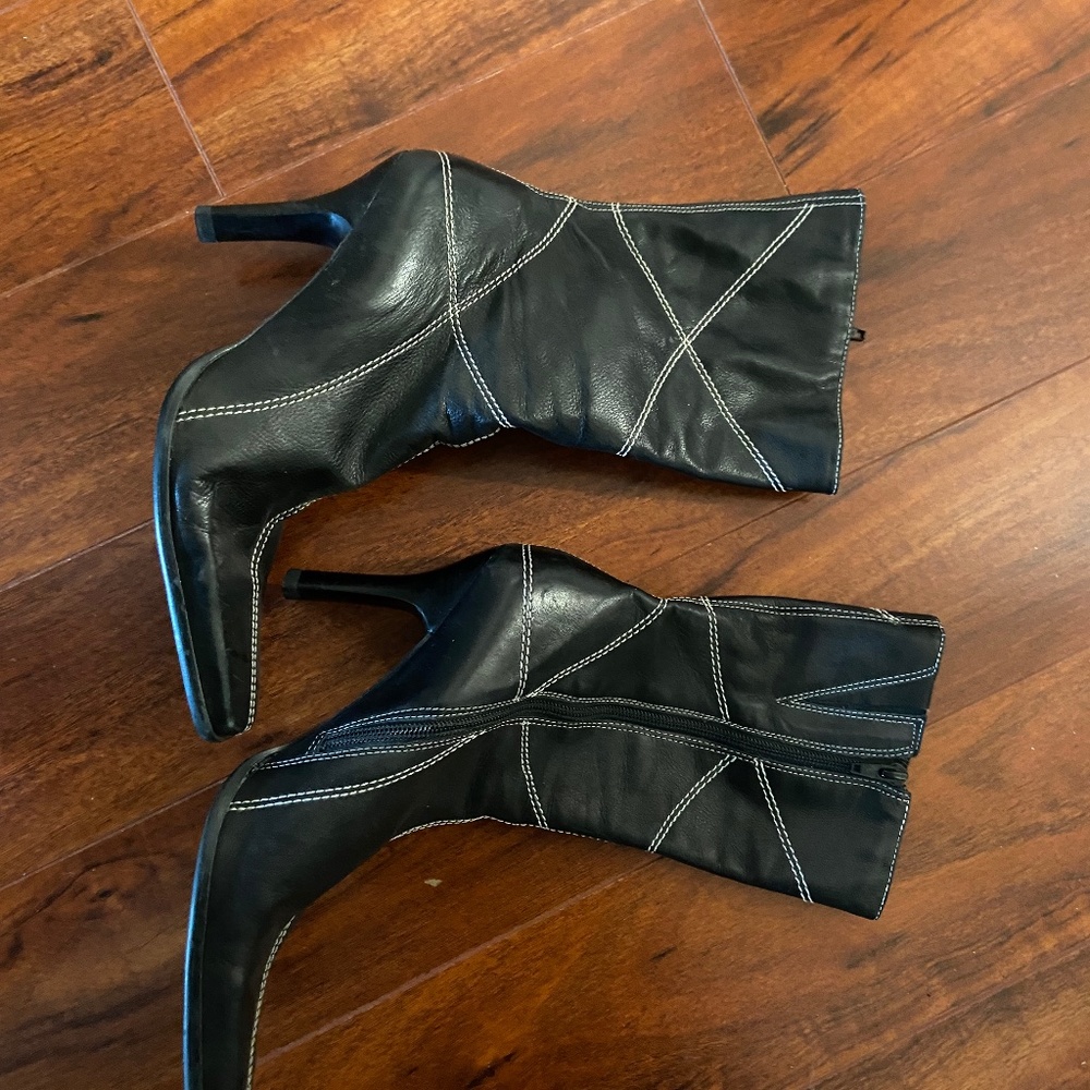 Vintage black leather boots with white stitching